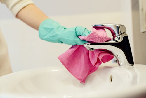 Professional cleaner handling a move-out clean in a local flat