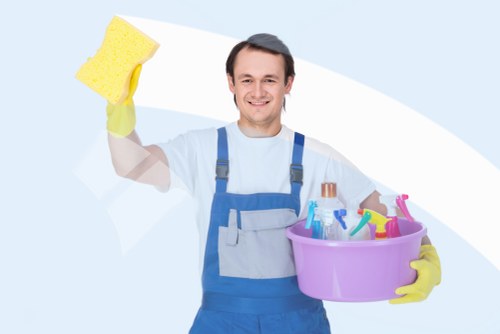 Tenant cleaning a kitchen during an end of tenancy clean