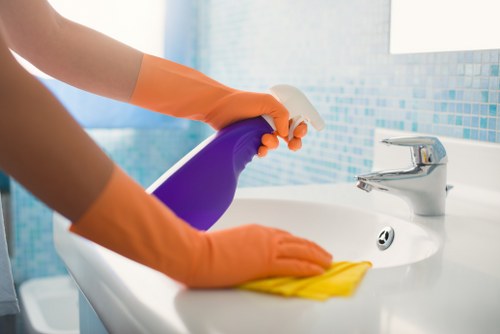 Cleaning team removing construction dust in a local rental property