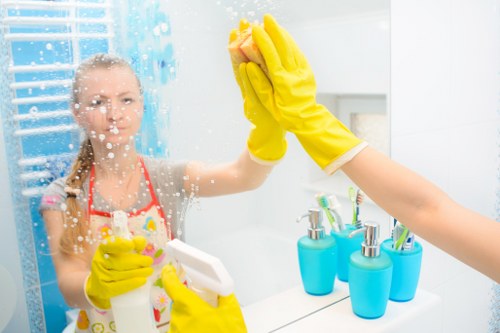 Cleaner handling a busy move-out property with access challenges