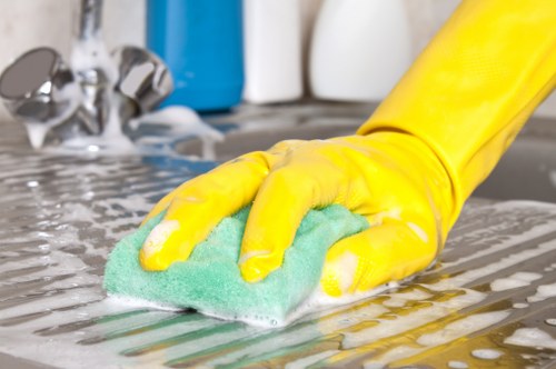 Local technician treating hallway carpet stains before move-out inspection